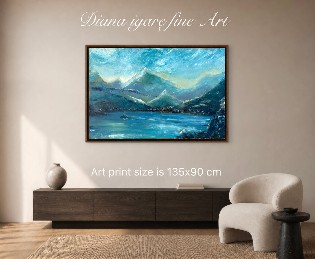 A framed landscape art print depicting blue mountains and a lake, displayed on a beige wall above a dark wood console in a modern living room setting. White text overlays read 'Diana igare fine Art' and 'Art print size is 135x90 cm'.